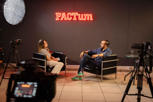 a woman doing an interview in a set